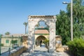 The gate of the ancient mosque Hala Sultan Tekke or the Mosque of Umm Haram near the shore of the salt lake in Cyprus in Larnaca Royalty Free Stock Photo