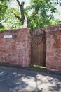 Gate in a brick fence along the street