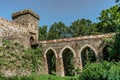 Gate and bridge to Bitov Castle on steep promontory towering above meandering River Zeletavka,Czech Republic.Popular Gothic