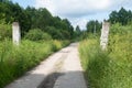 The gate is destroyed and the road to the forest