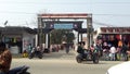 Gate of distric head hospital sundargarh in city road area & both side shop bike with peoe