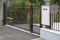 Gate with electric opener and outdoor electricity meter box cover and mailbox