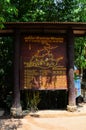 Gate entrance and wooden label in Emerald Pool or Sa Morakot turquoise blue pond at Thung Teao Forest Natural Park for thai people