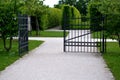 Gate and fence at the castle in the autumn sun. the lattice ending the end of the wall protected thieves from improper intruders. Royalty Free Stock Photo