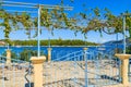 Gate and fence of traditional Greek house with vine growing on terrace in Fiskardo village, Kefalonia island, Greece Royalty Free Stock Photo