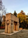 Gate of the Kiss by Constantin Brancusi side view in autumn