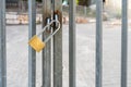 Gate Locked For Safety. Golden Padlock On Metal Gate.