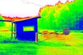 Gate and old gate house at small parking place at forest. Technical house and countryside in thermography scan. Royalty Free Stock Photo