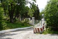 gate of the summer house of a corrupt official on the seashore. The thug general built his country house and put up a fence