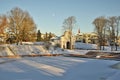 Gate of Tallinn in PÃÂ¤rnu, Estonia with a bandstand surrounded by trees in foreground on sunny winter day