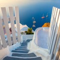Gate to heaven. Santorini, Greece. White architecture, open doors and steps to the blue sea of Santorini