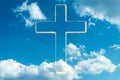 Gate to heaven. Shining cross in clouds on blue sky. Copy space. Ascension day concept. Christian Easter. Faith in Jesus