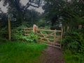 A Gate to a Woodland path though a ancient thoroughfare Devon uk