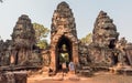 Gate with tourists walking through entrance to 12th century Preah Khan temple, Cambodia. Historical ruins of Angkor Royalty Free Stock Photo