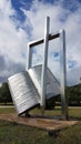 Gate of university on ioannina city, open book with pen, greece