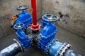 Gate valves in valve pit of the underground piping networks. Laying water system pipeline at construction site Royalty Free Stock Photo