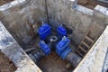 Gate valves in valve pit of the underground piping networks. Laying water system pipeline at construction site. Water supply Royalty Free Stock Photo