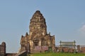 Gated entrance to Phra Prang Sam Yod and view of south tower, an ancient Buddhist temple in Lopburi, Thailand