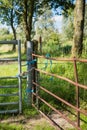 Gates locked with a chain and blue ropes from close Royalty Free Stock Photo