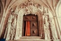 Gates of Santa Maria de Belem Church with carved entrance and decorations in Gothic style Royalty Free Stock Photo