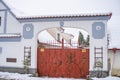 Gates in the snow in Hlasna Treban. The old standing gate is snowy with snow. Royalty Free Stock Photo