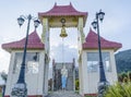 Gates and statue of Buddha in the yard of the buddhist temple Royalty Free Stock Photo