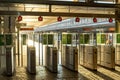 gates, gates, or turnstiles for accessing the train at the railway station with red signs. Royalty Free Stock Photo