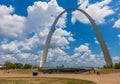 The Gateway Arch in St. Louis, Missouri with people walking around and sky with clouds in the background Royalty Free Stock Photo