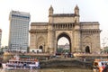 The Gateway of India and boats in the background Taj Mahal Hotel, Mumbai, India. Royalty Free Stock Photo