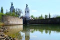 Gateway on the river with two sculptures of horsemen