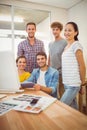 Gathered creative business team smiling at the camera Royalty Free Stock Photo