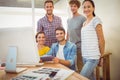 Gathered creative business team smiling at the camera Royalty Free Stock Photo