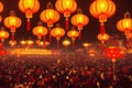 Gathered thousands of people and hanging colorful red, orange lanterns. Chinese New Year celebrations Royalty Free Stock Photo