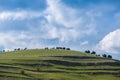 Gathering clouds over green meadow at springtime