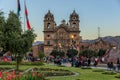 Gathering of crowd in front of the Church of the Society of Jesus in Cusco, Peru