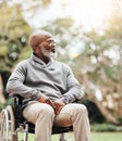 Gathering my thoughts outside today. a handsome senior man sitting in his wheelchair outside.