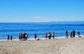 Gathering of people on seashore in Laguna Beach, Calfornia. Royalty Free Stock Photo