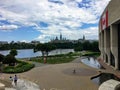 view of people walking outside the museum of civilization in Gatineau, Quebec with Parliament Hill in Ottawa,