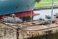 GATUN, PANAMA - MAY 29, 2016: Electric locomotives, known as mules guiding a container ship through Gatun Locks, part of Royalty Free Stock Photo