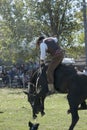 gaucho- cowboy-riding wild horse jumping jumping in a rodeo in argentina patron saint festival similar to uruguay chile-oct 2020