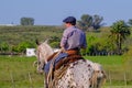 Gaucho on horse at a Criolla Festival in Caminos, Canelones, Uruguay, South America