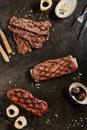 Gaucho Steak, Flank Steak and Tri-Tip Steak on Dark Backdrop Royalty Free Stock Photo