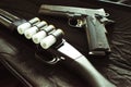 12 Gauge Shotgun With 1911 45 Auto Handgun Close Up With Lomo Effect Royalty Free Stock Photo