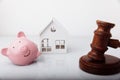 Gavel, broken piggy bank and house model isolated on white. Auction and bankruptcy concept Royalty Free Stock Photo