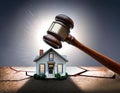 Gavel coming down on model house during auction or foreclosure Royalty Free Stock Photo
