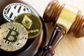 Gavel and cryptocurrency. Government regulation concept.
