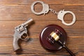 Gavel and gun and handcuffs Royalty Free Stock Photo