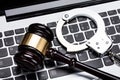 Gavel And Handcuff On Laptop Keyboard Royalty Free Stock Photo