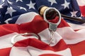 Gavel and handcuff lying flag of usa. Illegal concept Royalty Free Stock Photo