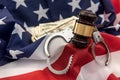 Gavel and handcuff lying flag of usa. Illegal concept Royalty Free Stock Photo